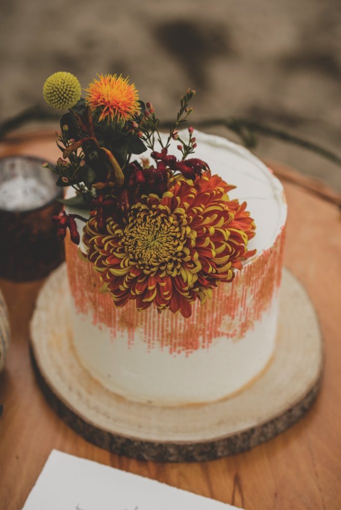 Detail Boho Vintage Wedding Semi Naked Cake with Yellow Flowers Autumn Fall Shot Wooden Plate Decoration Bronze
