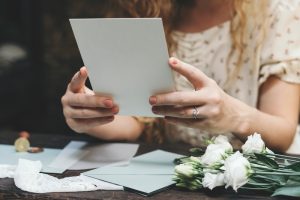 Woman,Preparing,A,Wedding,Invitation,Card