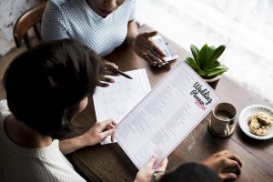 Hands Holding Wedding Planner Checklist Information Preparation